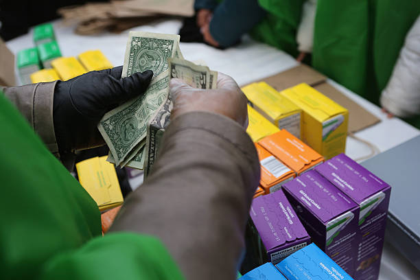 NEW YORK, NY - FEBRUARY 08:  MOney is collected as Girl Scouts sell cookies while a winter storm mo...