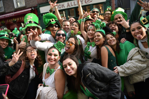 DUBLIN, IRELAND - MARCH 17: Thousands of revellers pack the Templebar disctrict following the Saint...