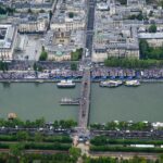 PARIS, FRANCE - JULY 26: In this aerial view taken from a helicopter shows the delegation boats navigating on the Seine in front of the Orsay Museum during the opening ceremony of the Olympic Games Paris 2024 on July 26, 2024 in Paris, France. (Photo by Lionel Bonaventure - Pool/Getty Images)