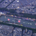 PARIS, FRANCE - JULY 26: (EDITOR'S NOTE: This Handout screengrab was provided by a third-party organization and may not adhere to Getty Images' editorial policy.) This handout released by the Olympic Broadcasting Services, shows an aerial view of the delegations boats navigating on the Seine past the Pont de l'Alma Bridge during the opening ceremony of the Olympic Games Paris 2024 on July 26, 2024 in Paris, France. (Screengrab by IOC via Getty Images)