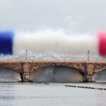 PARIS, FRANCE - JULY 26: Smoke resembling the flag of Team France is shown over Pont d’Austerlitz during the opening ceremony of the Olympic Games Paris 2024 on July 26, 2024 in Paris, France. (Photo by Kevin C. Cox/Getty Images)