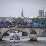 PARIS, FRANCE - JULY 26: Team Greece cruises during the athletes’ parade on the River Seine past Notre-Dame de Paris during the Opening Ceremony of the Olympic Games Paris 2024 on July 26, 2024 in Paris, France. (Photo by Markus Gilliar - GES Sportfoto/Getty Images)