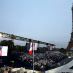 PARIS, FRANCE - JULY 26: The French National Flag is raised at Place du Trocadero during the opening ceremony of the Olympic Games Paris 2024 on July 26, 2024 in Paris, France . (Photo by Jamie Squire/Getty Images)