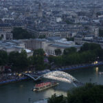 PARIS, FRANCE - JULY 26: Team Spain and Team Estonia pass under Passerelle Debilly during the opening ceremony of the Olympic Games Paris 2024 on July 26, 2024 in Paris, France. (Photo by Ezra Shaw/Getty Images)