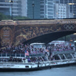 PARIS, FRANCE - JULY 26: Team United States of America cruises under the Austerlitz Bridge on the River Seine during the athletes parade during the opening ceremony of the Olympic Games Paris 2024 on July 26, 2024 in Paris, France. (Photo by Jared C. Tilton/Getty Images)