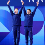 PARIS, FRANCE - JULY 27: Silver Medalists, Sarah Bacon and Kassidy Cook of Team United States acknowledge the fans during the Medal Ceremony after competing in the Women's Synchronised 3m Springboard Final on day one of the Olympic Games Paris 2024 at Aquatics Centre on July 27, 2024 in Paris, France. (Photo by Sarah Stier/Getty Images)