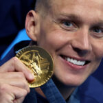 NANTERRE, FRANCE - JULY 27: Gold Medalist, Caeleb Dressel of Team United States poses with his medal following the Medal Ceremony after the Men's 4x100m Freestyle Relay Final on day one of the Olympic Games Paris 2024 at Paris La Defense Arena on July 27, 2024 in Nanterre, France. (Photo by Quinn Rooney/Getty Images)