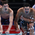 NANTERRE, FRANCE - JULY 27: Hunter Armstrong and Jack Alexy of Team United States react in the Men's 4x100m Freestyle Relay Final on day one of the Olympic Games Paris 2024 at Paris La Defense Arena on July 27, 2024 in Nanterre, France. (Photo by Maddie Meyer/Getty Images)