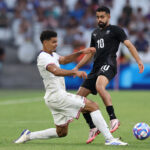 MARSEILLE, FRANCE - JULY 27: Miles Robinson #12 of Team United States tackles Sarpreet Singh #10 of Team New Zealand during the Men's group A match between New Zealand and United States during the Olympic Games Paris 2024 at Stade de Marseille on July 27, 2024 in Marseille, France. (Photo by Alex Livesey/Getty Images)