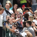 PARIS, FRANCE - JULY 28: Tom Cruise (L) greets fans during the Artistic Gymnastics Women's Qualification on day two of the Olympic Games Paris 2024 at Bercy Arena on July 28, 2024 in Paris, France. (Photo by Jamie Squire/Getty Images)