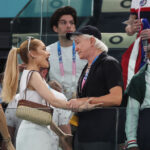 PARIS, FRANCE - JULY 28: Ariana Grande greets Baz Luhrmann as they attend the Artistic Gymnastics Women's Qualification on day two of the Olympic Games Paris 2024 at Bercy Arena on July 28, 2024 in Paris, France. (Photo by Jamie Squire/Getty Images)