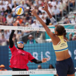 PARIS, FRANCE - JULY 28: Doaa Elghobashy of Team Egypt attacks the net against Ana Patricia Silva Ramos of Team Brazil during the Women's Preliminary Phase - Pool A match on day two of the Olympic Games Paris 2024 at Eiffel Tower Stadium on July 28, 2024 in Paris, France. (Photo by Cameron Spencer/Getty Images)