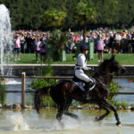 VERSAILLES, FRANCE - JULY 28: Caroline Pamukcu and horse HSH Blake of Team United States compete during the Equestrian Eventing Individual Cross Country leg on day two of the Olympic Games Paris 2024 at Chateau de Versailles on July 28, 2024 in Versailles, France. (Photo by Mike Hewitt/Getty Images)