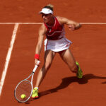 PARIS, FRANCE - JULY 28: Viktorija Golubic of Team Switzerland plays a forehand against Jessica Pegula of Team United States during the Women’s Singles first round match on day two of the Olympic Games Paris 2024 at Roland Garros on July 28, 2024 in Paris, France. (Photo by Matthew Stockman/Getty Images)