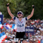 ELANCOURT, FRANCE - JULY 28: Haley Batten of Team United States celebrates winning silver as she crosses the finish line during the Women’s Cross-Country Cycling Mountain Bike Gold Medal race on day two of the Olympic Games Paris 2024 at Elancourt Hill on July 28, 2024 in Elancourt, France. (Photo by Tim de Waele/Getty Images)