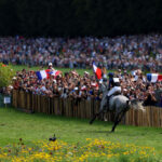 VERSAILLES, FRANCE - JULY 28: A general view as Nicolas Touzaint and horse Diabolo Menthe of Team France compete during the Equestrian Eventing Individual Cross Country leg on day two of the Olympic Games Paris 2024 at Chateau de Versailles on July 28, 2024 in Versailles, France. (Photo by Buda Mendes/Getty Images)