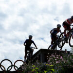 ELANCOURT, FRANCE - JULY 28: Laura Stigger of Team Austria (R) competes during the Women’s Cross-Country Cycling Mountain Bike Gold Medal race on day two of the Olympic Games Paris 2024 at Elancourt Hill on July 28, 2024 in Elancourt, France. (Photo by Tim de Waele/Getty Images)