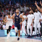 LILLE, FRANCE - JULY 28: Stephen Curry #4 of Team United States reacts to a three point basket during the first half of the Men's Group Phase - Group C game between Serbia and the United States on day two of the Olympic Games Paris 2024 at Stade Pierre Mauroy on July 28, 2024 in Lille, France. (Photo by Gregory Shamus/Getty Images)