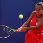 PARIS, FRANCE - JULY 28: Leylah Fernandez of Team Canada plays a backhand against Karolina Muchova of Team Czechia during the Women’s Singles first round match on day two of the Olympic Games Paris 2024 at Roland Garros on July 28, 2024 in Paris, France. (Photo by Matthew Stockman/Getty Images)