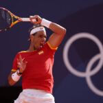 PARIS, FRANCE - JULY 28: Rafael Nadal of Team Spain plays a forehand against Marton Fucsovics of Team Hungary during the Men’s Singles first round match on day two of the Olympic Games Paris 2024 at Roland Garros on July 28, 2024 in Paris, France. (Photo by Clive Brunskill/Getty Images)