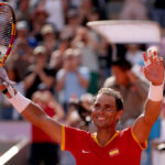 PARIS, FRANCE - JULY 28: Rafael Nadal of Team Spain celebrates after winning match point against Marton Fucsovics of Team Hungary during the Men’s Singles first round match on day two of the Olympic Games Paris 2024 at Roland Garros on July 28, 2024 in Paris, France. (Photo by Clive Brunskill/Getty Images)