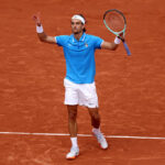 PARIS, FRANCE - JULY 28: Lorenzo Musetti of Team Italy celebrates after winning match point against Gael Monfils of Team France during the Men’s Singles first round match on day two of the Olympic Games Paris 2024 at Roland Garros on July 28, 2024 in Paris, France. (Photo by Clive Brunskill/Getty Images)