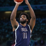 LILLE, FRANCE - JULY 28: Joel Embiid #11 of Team United States shoots the ball during the second half of the Men's Group Phase - Group C game between Serbia and the United States on day two of the Olympic Games Paris 2024 at Stade Pierre Mauroy on July 28, 2024 in Lille, France. (Photo by Gregory Shamus/Getty Images)