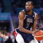 LILLE, FRANCE - JULY 28: Kevin Durant #7 of Team United States looks to pass against Vasilije Micic #22 of Team Serbia during the second half of the Men's Group Phase - Group C game between Serbia and the United States on day two of the Olympic Games Paris 2024 at Stade Pierre Mauroy on July 28, 2024 in Lille, France. (Photo by Gregory Shamus/Getty Images)