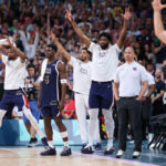 LILLE, FRANCE - JULY 28: Athletes of Team United States react on the bench during the second half of the Men's Group Phase - Group C game between Serbia and the United States on day two of the Olympic Games Paris 2024 at Stade Pierre Mauroy on July 28, 2024 in Lille, France. (Photo by Gregory Shamus/Getty Images)