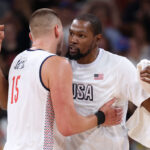 LILLE, FRANCE - JULY 28: Nikola Jokic #15 of Team Serbia and Kevin Durant #7 of Team United States hug after the Men's Group Phase - Group C game between Serbia and the United States on day two of the Olympic Games Paris 2024 at Stade Pierre Mauroy on July 28, 2024 in Lille, France. (Photo by Gregory Shamus/Getty Images)