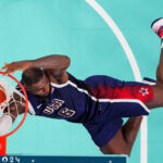 LILLE, FRANCE - JULY 28: (EDITORS NOTE: Image was captured using a remote camera positioned above the field of play) Lebron James #6 of Team United States dunks the ball against Team Serbia during the first half of the Men's Group Phase - Group C game between Serbia and the United States on day two of the Olympic Games Paris 2024 at Stade Pierre Mauroy on July 28, 2024 in Lille, France. (Photo by Pool/Getty Images)