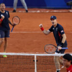 PARIS, FRANCE - JULY 28: Andy Murray of Team Great Britain (R) celebrates with partner Dan Evans of Team Great Britain against Kei Nishikori and Taro Daniel of Team Japan during the Men’s Doubles first round match on day two of the Olympic Games Paris 2024 at Roland Garros on July 28, 2024 in Paris, France. (Photo by Clive Brunskill/Getty Images)