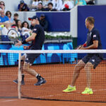 PARIS, FRANCE - JULY 28: Andy Murray of Team Great Britain (L) plays a forehand as partner Dan Evans of Team Great Britain looks on against Kei Nishikori and Taro Daniel of Team Japan during the Men’s Doubles first round match on day two of the Olympic Games Paris 2024 at Roland Garros on July 28, 2024 in Paris, France. (Photo by Clive Brunskill/Getty Images)