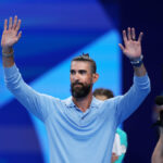 NANTERRE, FRANCE - JULY 28: Michael Phelps, former American swimmer, acknowledges the crowd on day two of the Olympic Games Paris 2024 at Paris La Defense Arena on July 28, 2024 in Nanterre, France. (Photo by Sarah Stier/Getty Images)