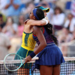 PARIS, FRANCE - JULY 28: Coco Gauff of Team United States (R) embraces defeated opponent Ajla Tomljanovic of Team Australia after their Women’s Singles first round match on day two of the Olympic Games Paris 2024 at Roland Garros on July 28, 2024 in Paris, France. (Photo by Matthew Stockman/Getty Images)