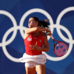 PARIS, FRANCE - JULY 28: Emma Navarro of Team United States plays a forehand against Julia Grabher of Team Austria during the Women’s Singles first round match on day two of the Olympic Games Paris 2024 at Roland Garros on July 28, 2024 in Paris, France. (Photo by Matthew Stockman/Getty Images)