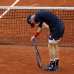 PARIS, FRANCE - JULY 28: Andy Murray of Team Great Britain reacts with partner (out of frame) Dan Evans of Team Great Britain against Kei Nishikori and Taro Daniel of Team Japan during the Men’s Doubles first round match on day two of the Olympic Games Paris 2024 at Roland Garros on July 28, 2024 in Paris, France. (Photo by Clive Brunskill/Getty Images)