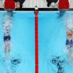 NANTERRE, FRANCE - JULY 28: (EDITORS NOTE: Image was captured using a robotic camera positioned above the field of play.) Torri Huske and Gretchen Walsh of Team United States approach the finish as they compete and win gold and silver in the Women’s 100m Butterfly Final on day two of the Olympic Games Paris 2024 at Paris La Defense Arena on July 28, 2024 in Nanterre, France. (Photo by Richard Heathcote/Getty Images)