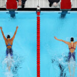 NANTERRE, FRANCE - JULY 28: (EDITORS NOTE: Image was captured using a robotic camera positioned above the field of play.) Torri Huske and Gretchen Walsh of Team United States approach the finish as they compete and win gold and silver in the Women’s 100m Butterfly Final on day two of the Olympic Games Paris 2024 at Paris La Defense Arena on July 28, 2024 in Nanterre, France. (Photo by Richard Heathcote/Getty Images)