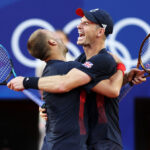 PARIS, FRANCE - JULY 28: Andy Murray of Team Great Britain (R) and partner Dan Evans of Team Great Britain celebrate after winning match point against Kei Nishikori and Taro Daniel of Team Japan in the Men’s Doubles first round match on day two of the Olympic Games Paris 2024 at Roland Garros on July 28, 2024 in Paris, France. (Photo by Clive Brunskill/Getty Images)