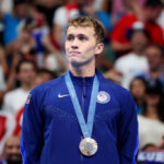 NANTERRE, FRANCE - JULY 28: Bronze Medalist Carson Foster of Team United States stands on the podium during the Swimming medal ceremony after the Men’s 400m Individual Medley Final on day two of the Olympic Games Paris 2024 at Paris La Defense Arena on July 28, 2024 in Nanterre, France. (Photo by Quinn Rooney/Getty Images)