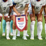 MARSEILLE, FRANCE - JULY 28: A general view of the United States match pennant during the team photo prior to the Women's group B match between United States and Germany during the Olympic Games Paris 2024 at Stade de Marseille on July 28, 2024 in Marseille, France. (Photo by Alex Livesey/Getty Images)