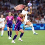 MARSEILLE, FRANCE - JULY 28: Trinity Rodman #5 of Team United States heads the ball against Felicitas Rauch #19 of Germany during the Women's group B match between United States and Germany during the Olympic Games Paris 2024 at Stade de Marseille on July 28, 2024 in Marseille, France. (Photo by Alex Livesey/Getty Images)