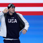 NANTERRE, FRANCE - JULY 28: Nic Fink of Team United States gestures as he walks out ahead of the Men’s 100m Breaststroke Final on day two of the Olympic Games Paris 2024 at Paris La Defense Arena on July 28, 2024 in Nanterre, France. (Photo by Sarah Stier/Getty Images)