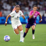 MARSEILLE, FRANCE - JULY 28: Trinity Rodman #5 of Team United States and Felicitas Rauch #19 of Team Germany chase the ball during the Women's group B match between United States and Germany during the Olympic Games Paris 2024 at Stade de Marseille on July 28, 2024 in Marseille, France. (Photo by Alex Livesey/Getty Images)