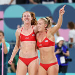 PARIS, FRANCE - JULY 28: Kelly Cheng and Sara Hughes of Team United States celebrate after defeating Team Czechia during the Women's Preliminary Phase - Pool C match on day two of the Olympic Games Paris 2024 at Eiffel Tower Stadium on July 28, 2024 in Paris, France. (Photo by Cameron Spencer/Getty Images)