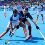 PARIS, FRANCE - JULY 29: Raj Kumar Pal of Team India runs with the ball whilst under pressure from Nicolas Della Torre of Team Argentina during the Men's Pool B match between India and Argentina on day three of the Olympic Games Paris 2024 at Stade Yves Du Manoir on July 29, 2024 in Paris, France. (Photo by Lintao Zhang/Getty Images)