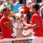 PARIS, FRANCE - JULY 29: Winner Novak Djokovic of Team Serbia (R) is congratulated by Rafael Nadal of Team Spain after the Men's Singles second round match on day three of the Olympic Games Paris 2024 at Roland Garros on July 29, 2024 in Paris, France. (Photo by Clive Brunskill/Getty Images)