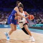 LILLE, FRANCE - JULY 29: Alexia Chery #6 of Team France attempts to steal the ball from Kia Nurse #5 of Team Canada during the Women's Group Phase - Group B game between Canada and France on day three of the Olympic Games Paris 2024 at Stade Pierre Mauroy on July 29, 2024 in Lille, France. (Photo by Gregory Shamus/Getty Images)