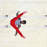 PARIS, FRANCE - JULY 29: (EDITORS NOTE: Image was captured using a robotic camera positioned above the field of play.) Frederick Richard of Team United States competes on the parallel bars during the Artistic Gymnastics Men's Team Final on day three of the Olympic Games Paris 2024 at Bercy Arena on July 29, 2024 in Paris, France. (Photo by Dan Mullan/Getty Images)